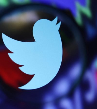 Twitter logo and stock graph are seen through a magnifier displayed in this illustration taken September 4, 2022. REUTERS/Dado Ruvic/Illustration